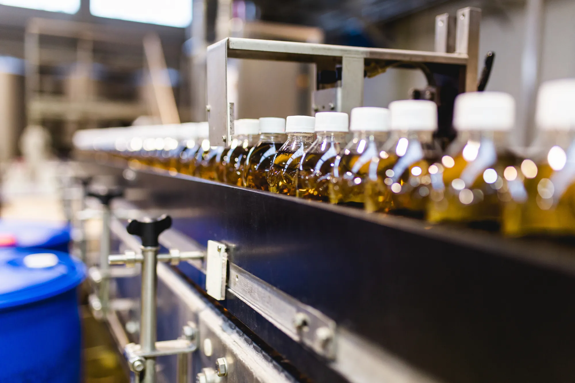 Flat vector illustration of automatic case packing line with robotic arm and conveyor belts